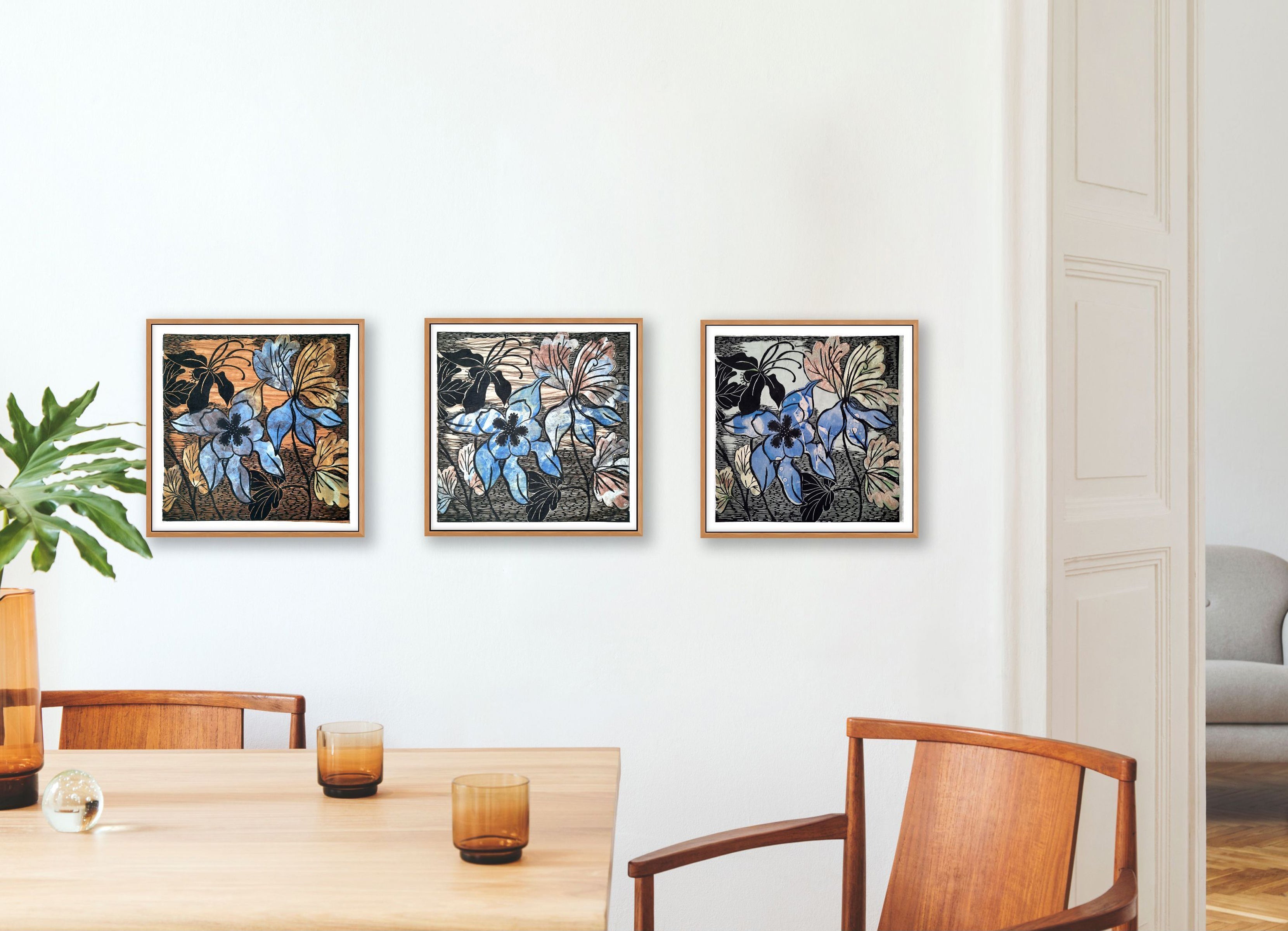 interior of dining room with 3 columbines in frames